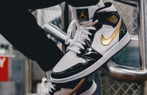 Nike Jordan 1 Mid Patent Black White Gold 852542-007 on foot 02