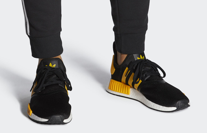 adidas NMD R1 Active Gold Black FY9382 on foot 01