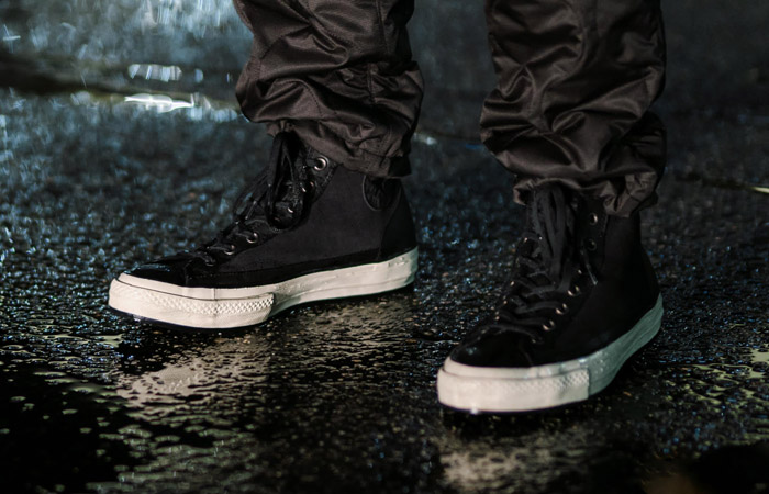 black leather converse on feet