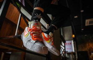 sacai Nike Blazer Low White Magma Orange DD1877-100 on foot 03