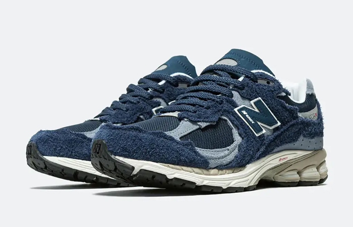 New Balance 2002R Protection Pack Navy Grey M2002RDK front corner
