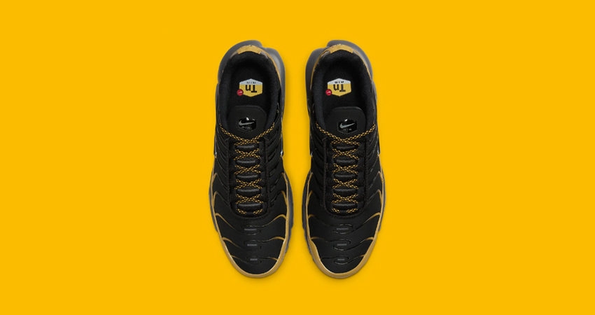 The Nike Air Max Plus Adorns A Black And University Gold Colourway up