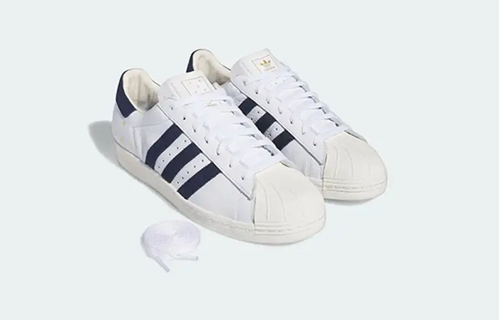 Pop Trading Company × adidas Superstar ADV White Navy IE3408 lifestyle front corner